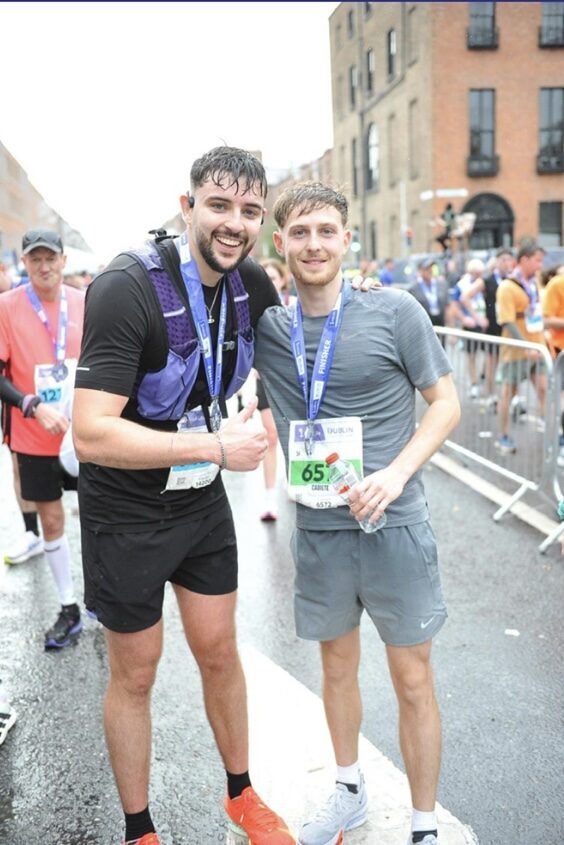 Dan and a friend after finishing the Dublin Marathon