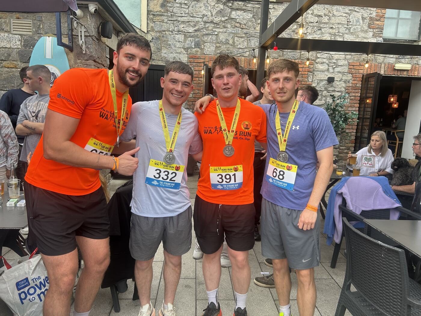 Dan celebrating with friends after the Warriors Run race